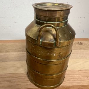 Klein koperen melkbusje als spaarpot